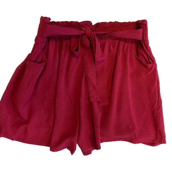 Maroon shorts with a tie waist on a white background