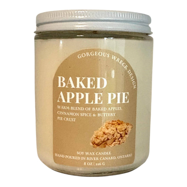 Jar of 'Baked Apple Pie' candle with a label on a white background