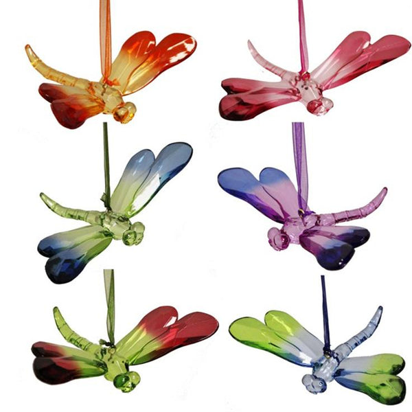 Colorful dragonfly-shaped wind chimes on a white background
