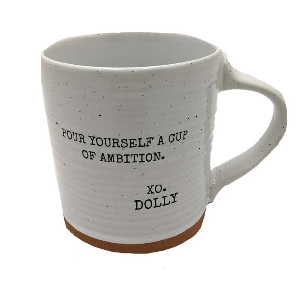 White speckled mug with text 'Pour yourself a cup of ambition. xo. Dolly' on a white background