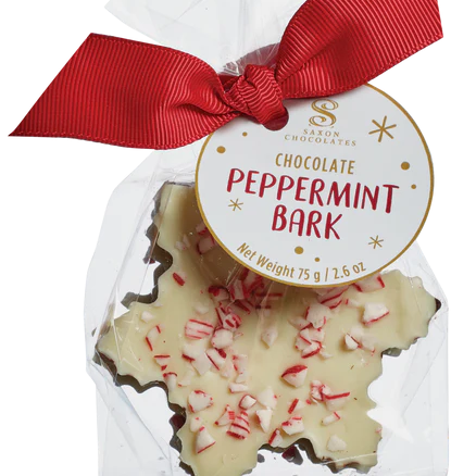 Packaged chocolate peppermint bark with a red ribbon and label on a white background