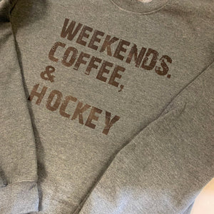 Gray sweatshirt with 'Weekends, Coffee, Hockey' text on a light background