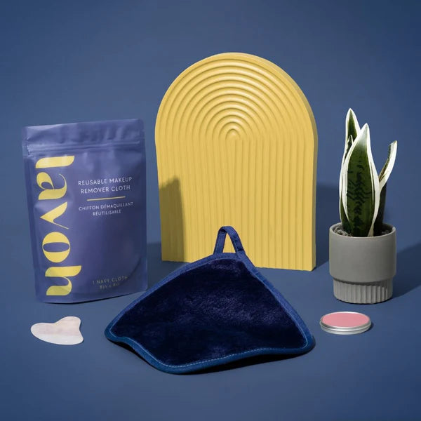 Collection of reusable makeup remover products on a blue background