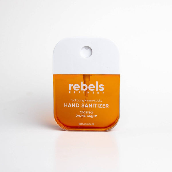 Hand sanitizer bottle with 'rebel's' branding on a white background
