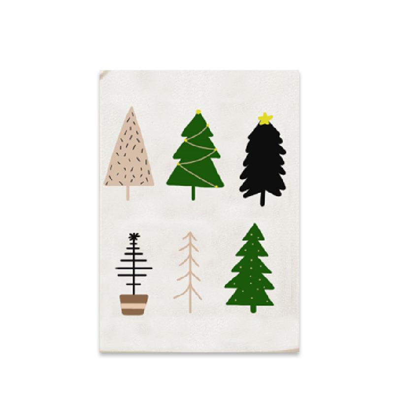 White towel with various Christmas tree designs on a white background
