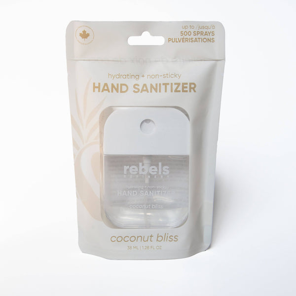 A packaged bottle of Rebels Hand Sanitizer in the Coconut Bliss scent, sealed in a white and beige stand-up pouch with a clear front window.
