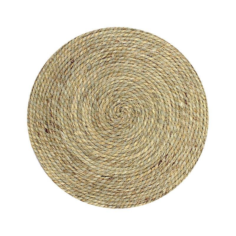 Round woven mat on a white background