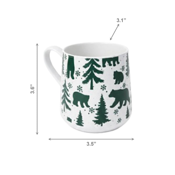 A white ceramic mug with a dark green forest pattern of bears, trees, and snowflakes, shown with dimension lines indicating its height of 3.6 inches, width of 3.