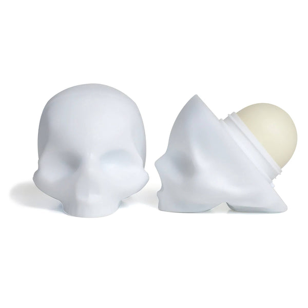 White skull-shaped container with a cream-like substance on a white background