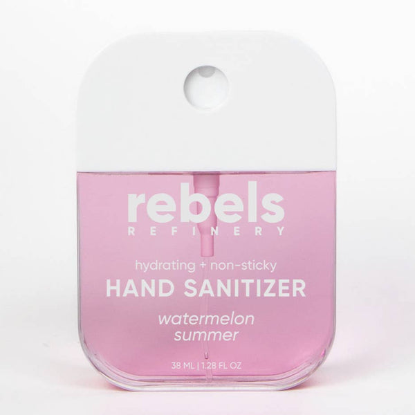 Pink hand sanitizer bottle with 'rebels refinery' branding on a white background