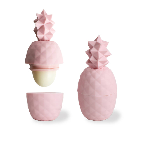 Pink pineapple-shaped container with a smaller pink cup on a white background