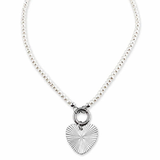 A silver beaded necklace featuring a textured heart-shaped pendant with a sunburst pattern, suspended from a circular ring clasp, shown on a plain white background.