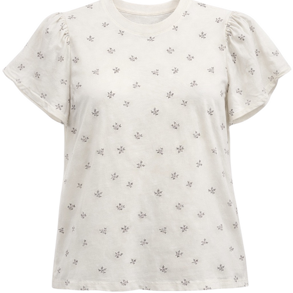 White t-shirt with small black floral pattern on a white background