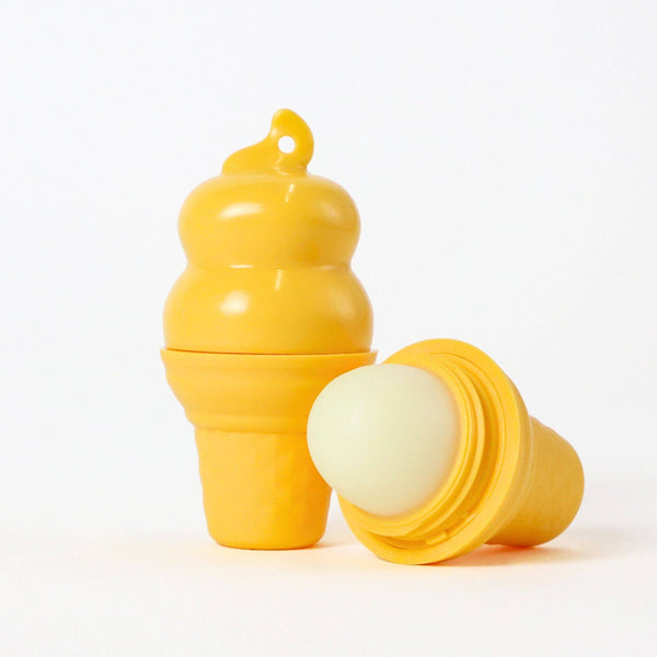 Yellow lip balm with a matching container on a white background