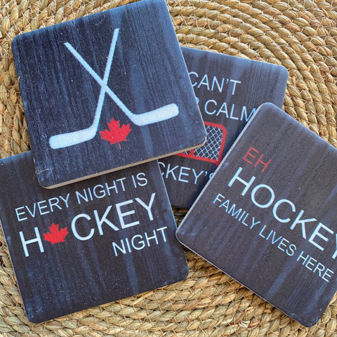 Set of hockey-themed coasters on a woven surface