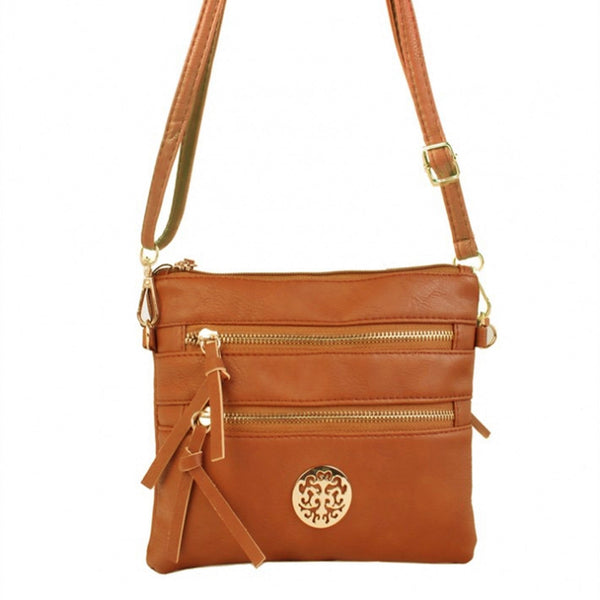 Brown crossbody bag with gold accents on a white background