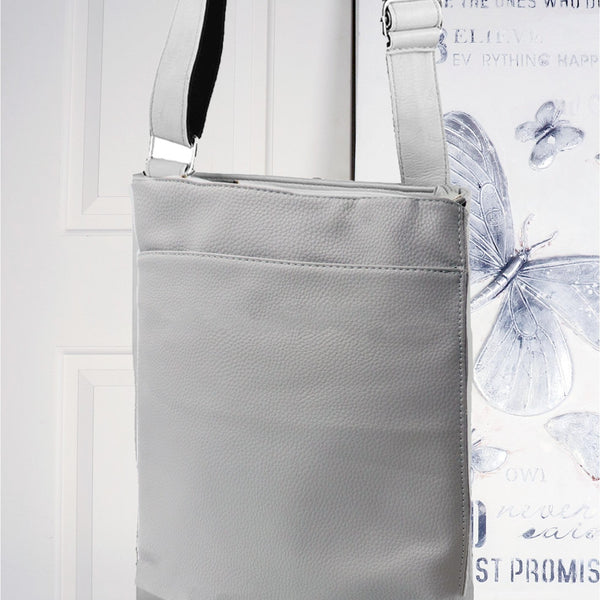 Gray crossbody bag on a white background