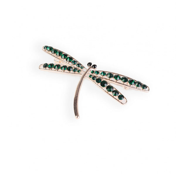 Brooch with green gemstones on a white background