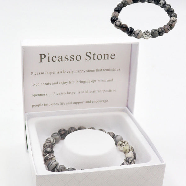 Beaded bracelet with Picasso Stone in a branded box on a white background