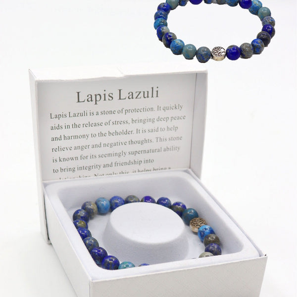 Lapis Lazuli beaded bracelet in a white box with information card on a white background
