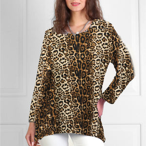 Woman wearing a leopard print top against a white background