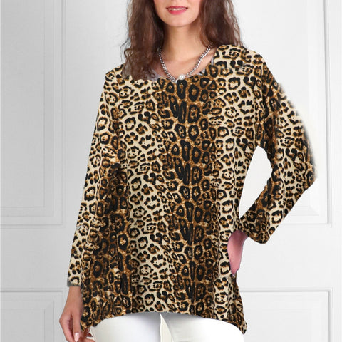Woman wearing a leopard print top against a white background