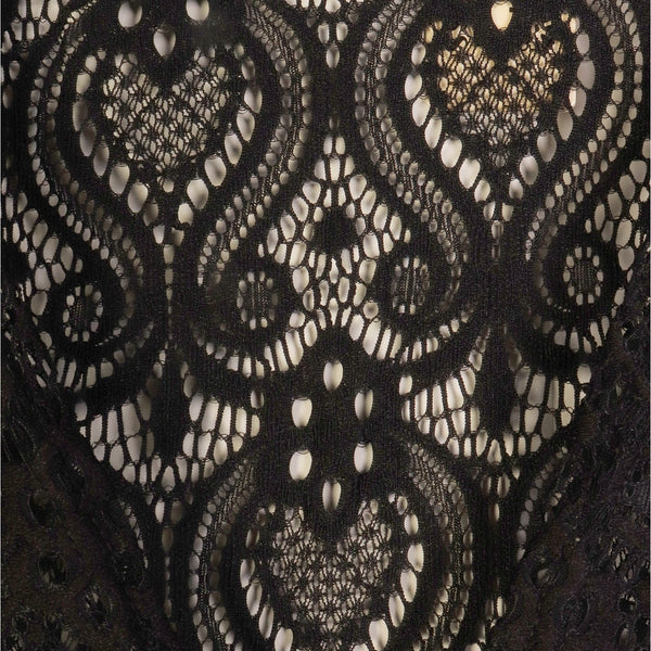 Close-up of black lace fabric with intricate patterns