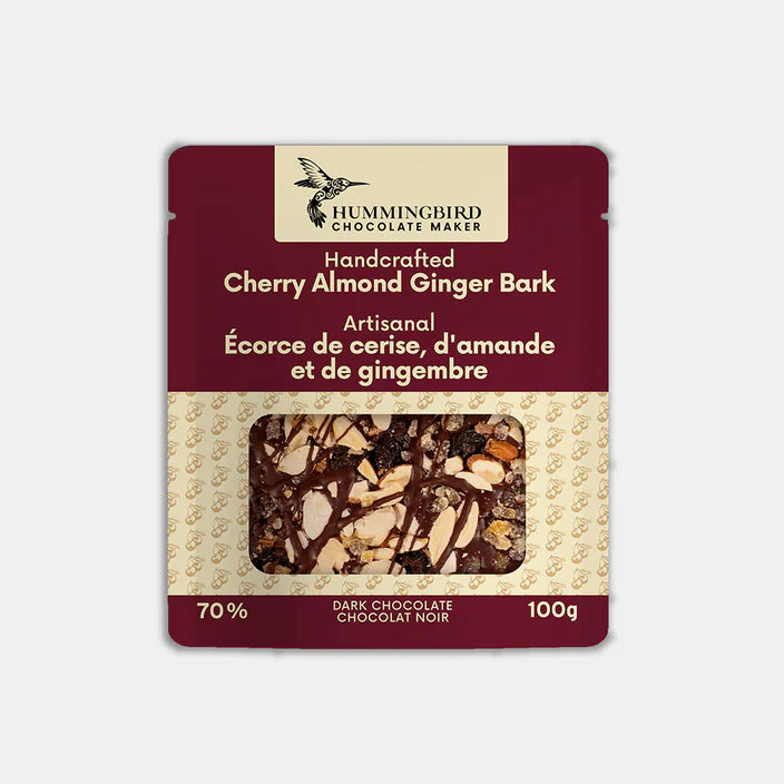 Packaged cherry almond ginger bark with Hummingbird Chocolate Maker branding on a light gray background