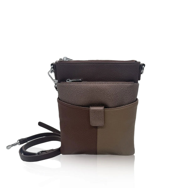 Brown leather crossbody bag with a strap on a white background