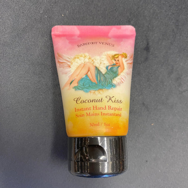 Small tube of coconut kiss product on a gray surface