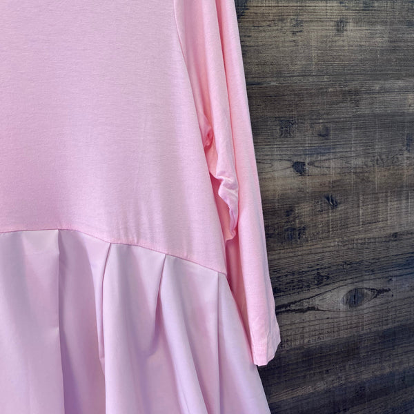 Pink fabric on a wooden surface