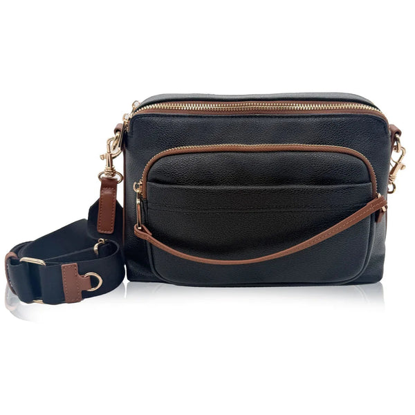 Black leather crossbody bag with brown accents on a white background