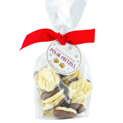 Bag of Polar Pretzels with a red ribbon on a white background