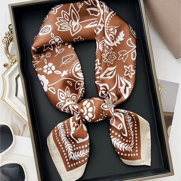 Brown and beige patterned scarf in a decorative box