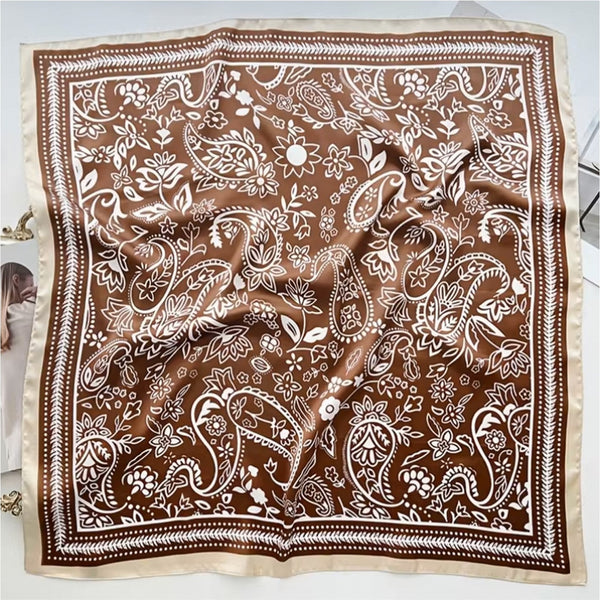Brown paisley patterned scarf on a white background