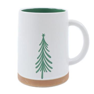 White mug with green tree design on a white background