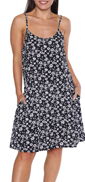 Woman wearing a black floral dress on a white background
