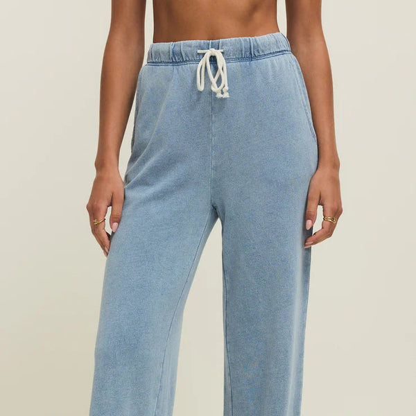 Light blue wide-leg pants worn by a person on a neutral background