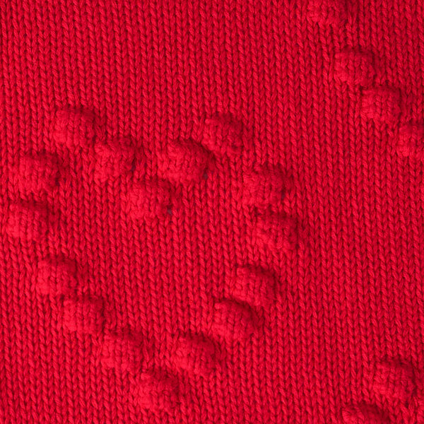 Close-up of red fabric with a textured pattern