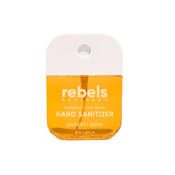 A small bottle of Rebels Refinery pumpkin spice hand sanitizer with a white cap and orange liquid inside, shown on a plain white background.